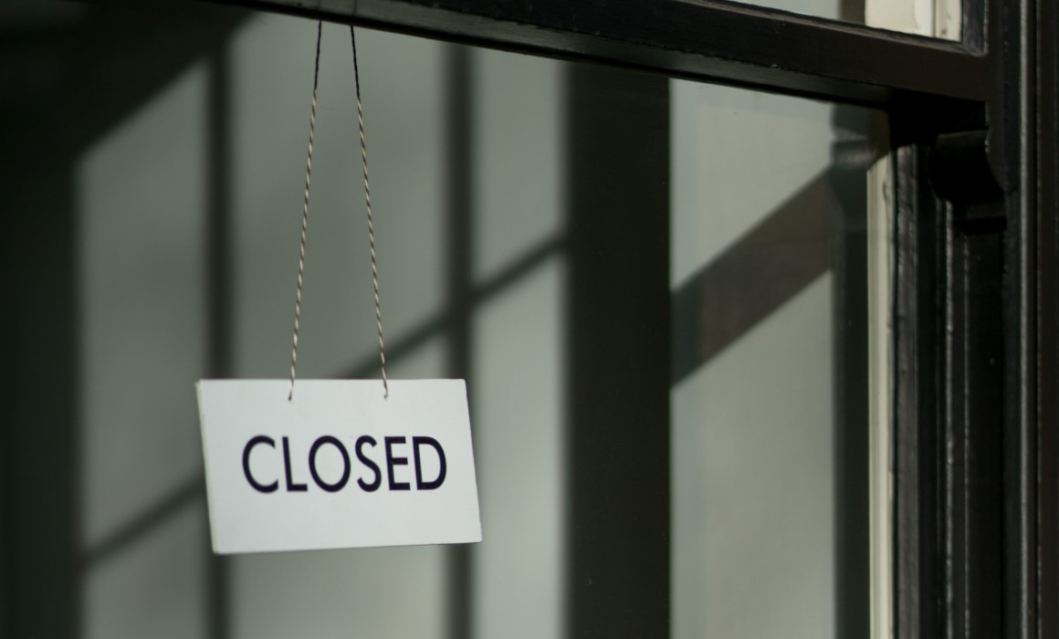 an image of a closed sign in a store window