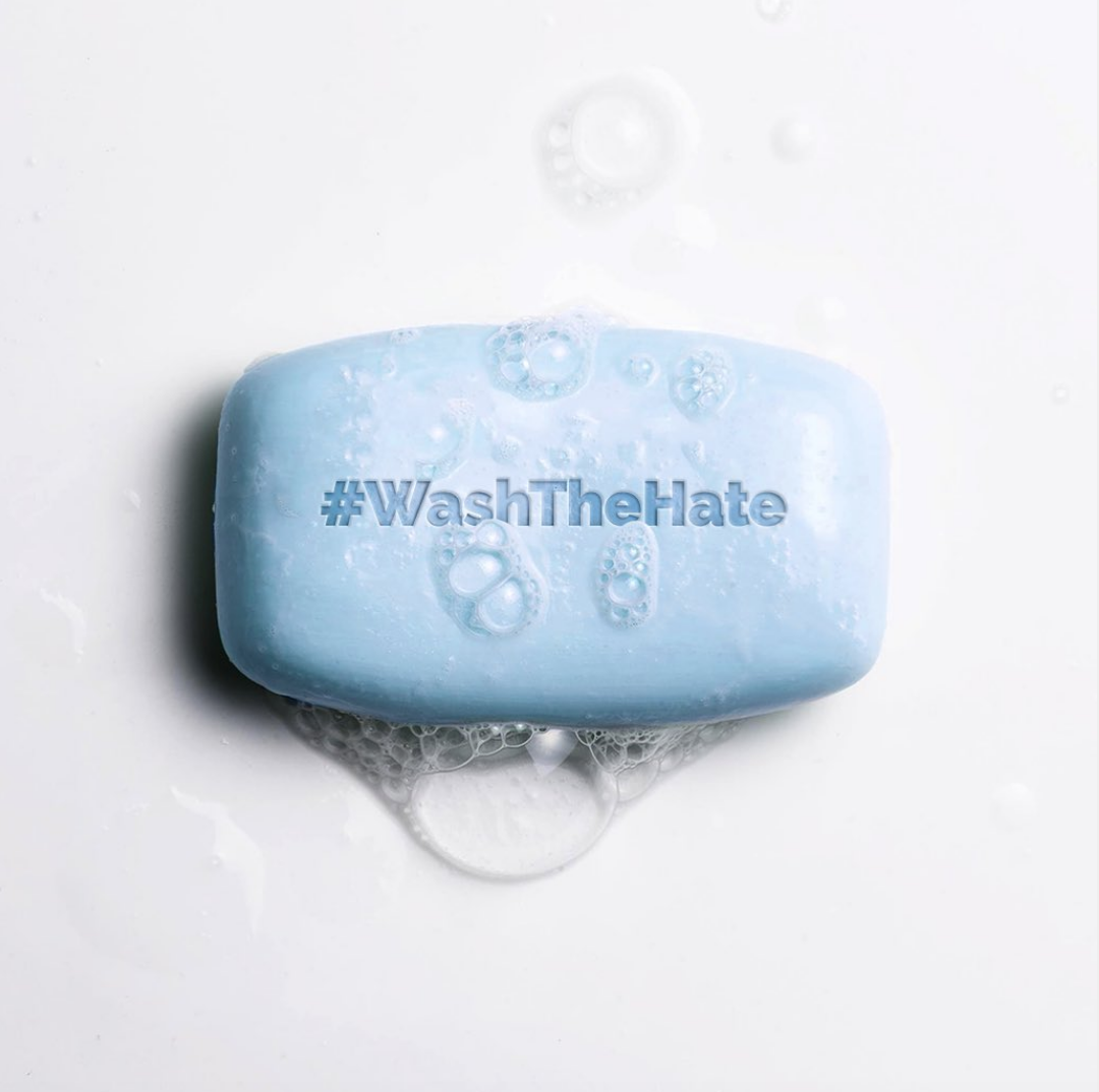 an image of a bar of soap with the words #WashTheHate imprinted on it