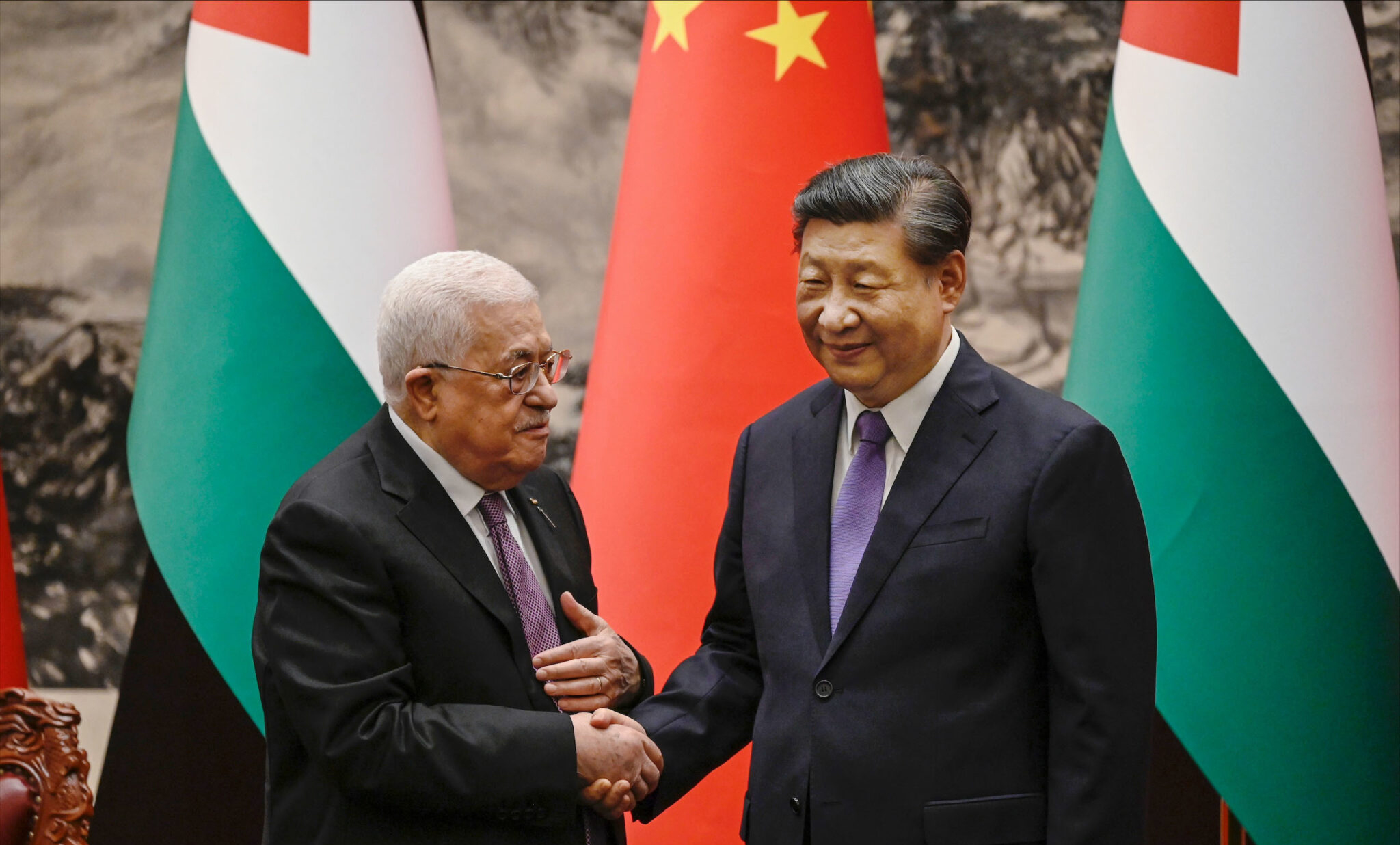 Chinese President Xi Jinping and Palestinian Authority leader Mahmoud Abbas in Beijing on June 14, 2023. Photo via Kyodo.